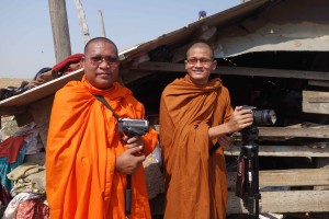 Venerable Luon Sovath and Venerable Prim Houn recording video testimonies at Boeung Kak Lake community during training.